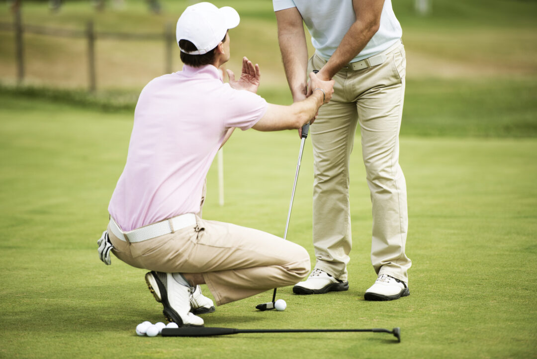 Golf lesson on putting green